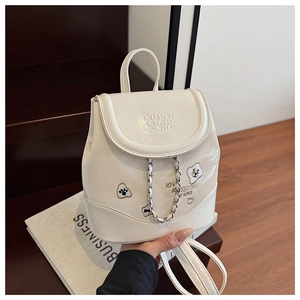 Detail of off-white backpack with animal embroidery and letter embossing texture