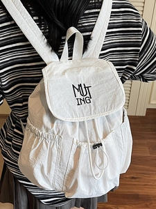 Minimalist white nylon backpack with MUTING logo and drawstring closure for women