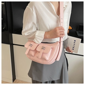 Detail of pink PU leather tote with front pockets and adjustable metal buckle strap