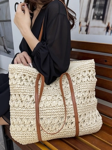 Bohemian woven straw tote bag in beige with floral crochet detail and brown straps