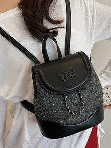 Polka dot fabric and black leather backpack for women with silver metal chain detail