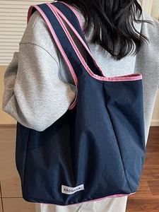 Navy blue large capacity nylon tote bag with pink trim for daily commuting use
