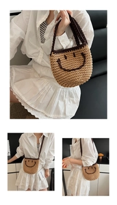 Detailed knit texture and smiley face pattern on yellow woven straw bucket bag