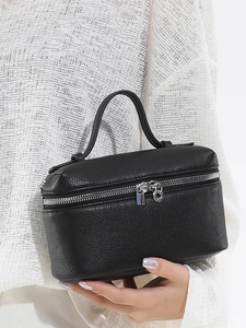 Elegant black lychee textured leather handbag with silver hardware and top handle