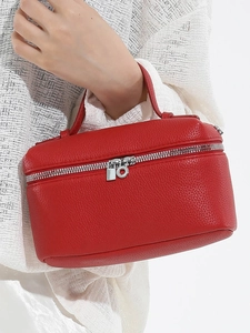Chic red litchi grain leather handbag with top handle and silver zipper for women