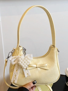 Borsa baguette vintage in pelle gialla con fiocco e ciondolo cuore per donna