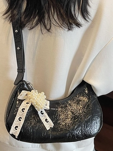 Minimalist black patent leather baguette bag with lace bow and pearl charm for women