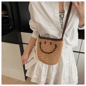 Detailed knit texture of a Japanese smile bucket bag with a hand-woven shoulder strap