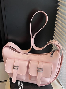Pink crescent moon hobo bag with dual cargo pockets and adjustable wide shoulder strap