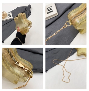 Detail der sternförmigen Umhängetasche mit Goldglitzer und hochwertiger Kettenhardware