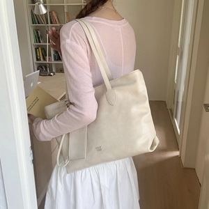 Chic beige faux leather tote bag with shoulder strap and matching mini card holder pouch