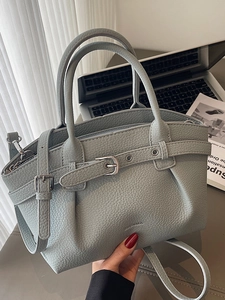 Chic pleated bucket bag in light grey-blue leather with top handles and shoulder strap