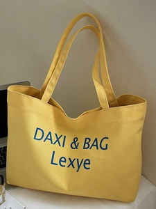 Große gelbe Canvas-Einkaufstasche mit blauer DAXI & BAG Bestickung für den Sommer