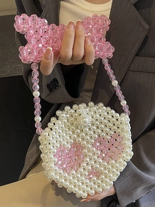 Handmade pearl bead handbag with pink skull pattern and chain strap for women