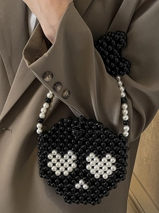 Handmade beaded mini crossbody bag with black pearls and white heart pattern