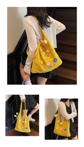 Detail of yellow crochet tote bag with colorful 3D flowers and woven hollow texture