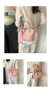 Detail of light pink pleated tote bag with stylish checkered ribbon and detachable strap