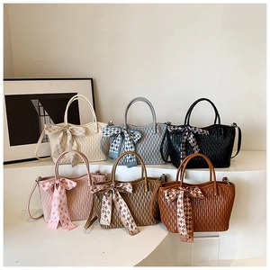 Collection of pleated tote bags in six colors with decorative silk scarves and metal D-rings