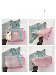 Detail view of pink and cyan mesh beach bag showing multi-pocket structure and quick-dry nylon