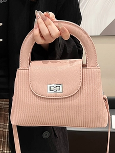Pink striped textured crossbody bag with metal twist lock and top handle for women