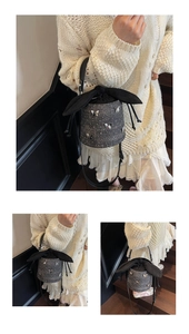 Détails du sac seau gris à paillettes avec décor de papillon et fermeture à cordon noir