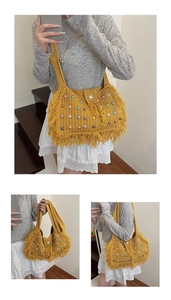 Detail of yellow knit bag featuring colorful faux pearls and decorative fringe trim