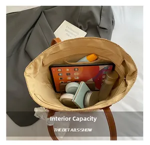 Interior view of the woven tote bag showing large capacity for tablet and cosmetics