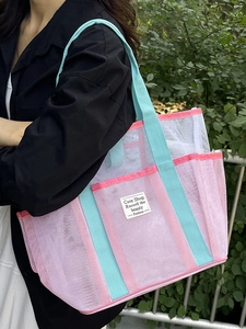 Pink mesh tote beach bag with blue straps and large capacity for summer travel