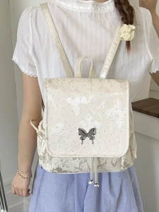 Cream white mini butterfly backpack with metallic butterfly clasp and soft glossy finish