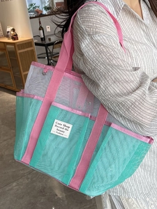 Large capacity mesh beach tote bag in mint green and pink with multiple pockets