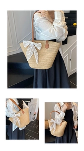 Detail of woven straw tote bag featuring white lace bow and brown leather straps