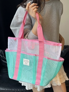 Mesh swimming beach bag in mint green and pink with multiple pockets and large capacity