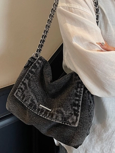 Retro washed denim tote bag with silver chain strap and metal trim decoration