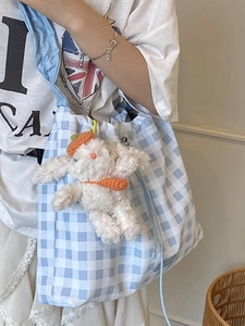 Blue gingham canvas tote bag with drawstring closure and cute plush animal keychain