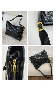 Détails du sac en cuir verni noir matelassé avec clous argentés et ferrures dorées