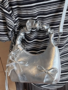 Silver bow ruched hobo bag with metallic finish and crescent shape for women