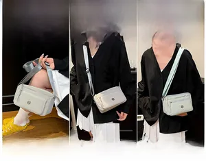Waterproof nylon crossbody bag showing handheld, shoulder and crossbody wearing styles