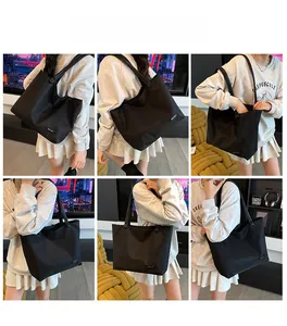 Detailed close-up showing the durable nylon fabric and large capacity of this black tote bag