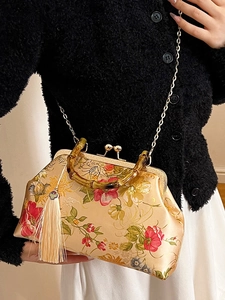 Floral brocade handbag with bamboo handle and gold chain strap for elegant style