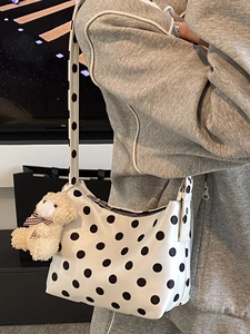 Polka dot shoulder bag for women with cute plush bear charm in a casual summer style