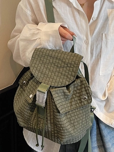 Green plaid canvas backpack for women featuring large capacity and stylish buckle closure