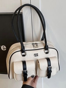 Retro canvas and black leather boston bag with stylish front pockets and top handles