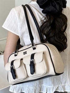 Chic cream textured hobo shoulder bag with black trim and silver buckles for women