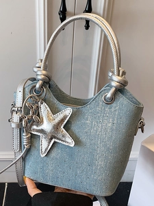 Blue denim bucket bag with sparkling sequins, round metal handle and star charm