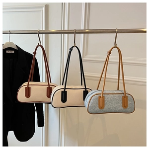 Detailed comparison of three vintage bowling-style shoulder bags in various color combinations