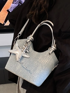 Silver metallic bucket bag with ostrich texture and star pendant for women