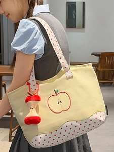 Cute apple embroidered yellow canvas tote bag with polka dot straps and plush charm