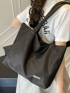 Minimalist large capacity black nylon tote bag for women with leather shoulder straps