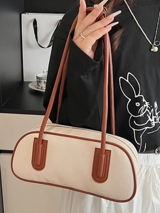 Minimalist bowling tote bag with cream canvas and brown leather straps for women