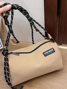 Chic beige canvas cylinder crossbody bag with woven strap and LOUIE SAMANI logo